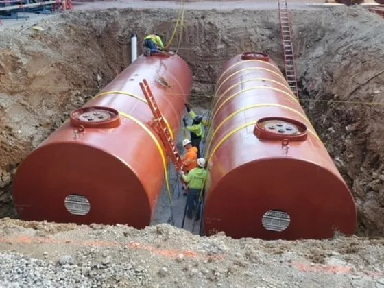 Underground wastewater storage tanks being installed at an industrial site